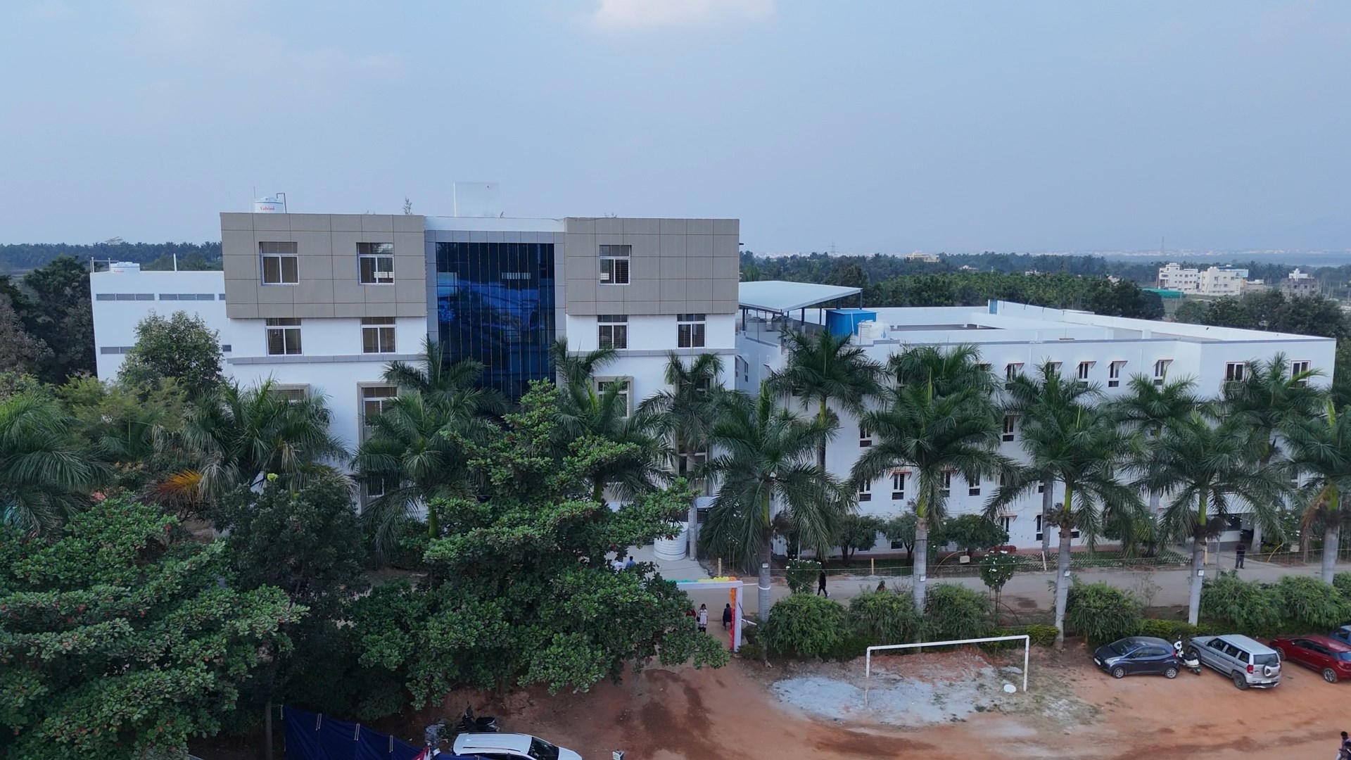 Aerial view of Koddur campus with sports and swimming facilities